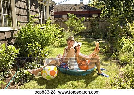 Couple Holding Books In A Wading Pool Stock Photo Bcp833 28