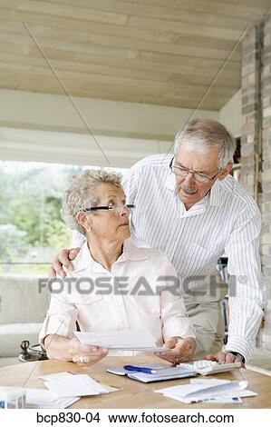 Couple preparing home finance budget View Large Photo Image Picture - Couple preparing home finance budget. Fotosearch