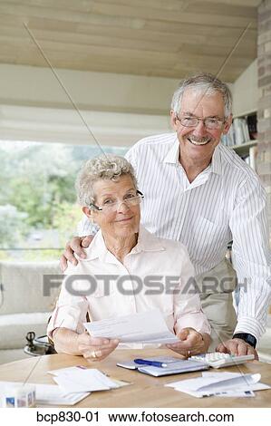 Couple preparing home finance budget View Large Photo Image Stock Image - Couple preparing home finance budget. Fotosearch
