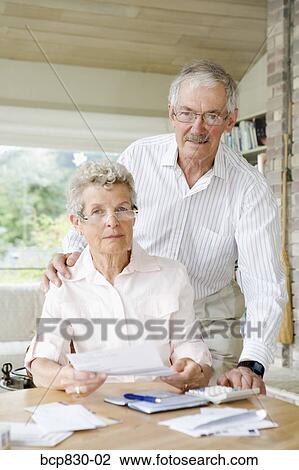 Couple preparing home finance budget View Large Photo Image Stock Image - Couple preparing home finance budget. Fotosearch