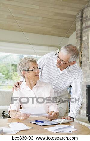 Couple preparing home finance budget View Large Photo Image Stock Image - Couple preparing home finance budget. Fotosearch