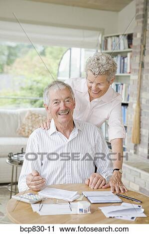 Couple preparing home finance budget View Large Photo Image Stock Image - Couple preparing home finance budget. Fotosearch