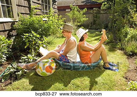 Couple Reading Books In A Wading Pool Stock Photo Bcp833 27