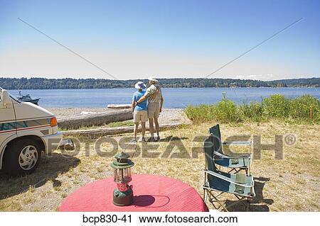 Couple standing at a beach, Washington State, USA View Large Photo Image Stock Image - Couple standing at a beach, Washington State, USA. Fotosearch