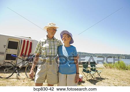 Couple standing at a beach, Washington State, USA View Large Photo Image Stock Image - Couple standing at a beach, Washington State, USA. Fotosearch
