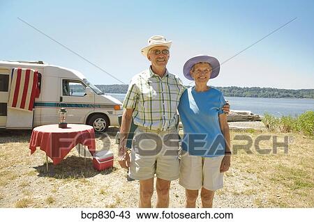 Couple standing at a beach, Washington State, USA View Large Photo Image Stock Image - Couple standing at a beach, Washington State, USA. Fotosearch