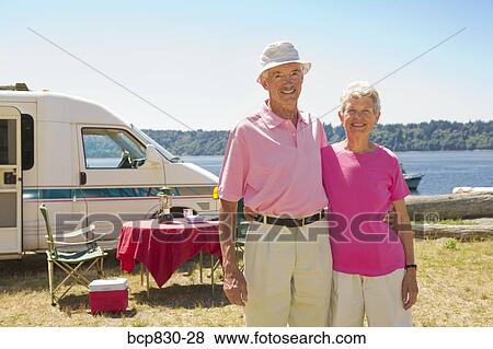 Couple standing at a beach, Washington State, USA View Large Photo Image Stock Photo - Couple standing at a beach, Washington State, USA. Fotosearch