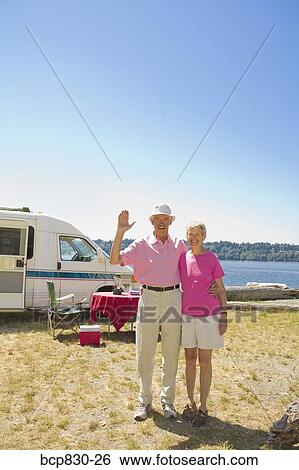 Couple standing at a beach, Washington State, USA View Large Photo Image Stock Photograph - Couple standing at a beach, Washington State, USA. Fotosearch