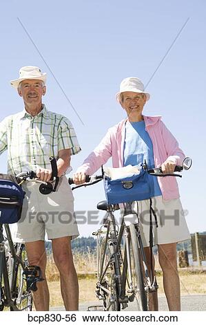 Couple with their bicycles, Washington State, USA View Large Photo Image Stock Photograph - Couple with their bicycles, Washington State, USA. Fotosearch
