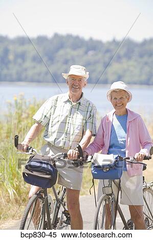 Stock Photography - Couple with their bicycles, Washington State, USA. Fotosearch