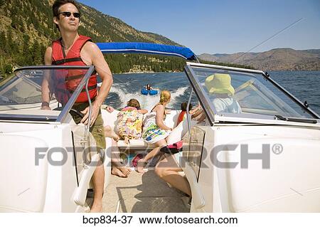 Family in a motorboat, Lake Chelan, Washington State, USA View Large Photo Image Stock Photo - Family in a motorboat, Lake Chelan, Washington State, USA. Fotosearch