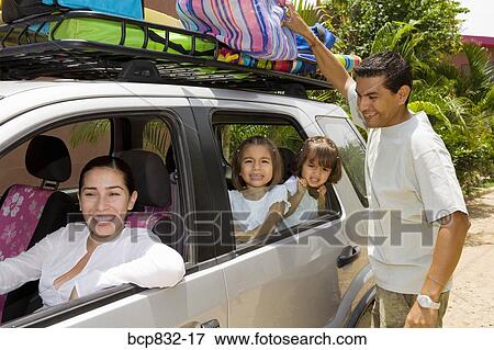 Stock Photo - Family preparing for vacation. Fotosearch