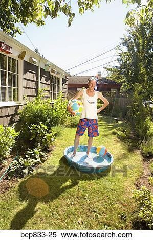 Man wearing snorkel and holding a ball in a wadding pool View Large Photo Image Stock Photography - Man wearing snorkel and holding a ball in a wadding pool. Fotosearch