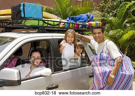 Portrait of a family preparing for vacation View Large Photo Image Stock Photo - Portrait of a family preparing for vacation. Fotosearch