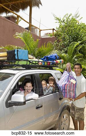 Portrait of a family preparing for vacation View Large Photo Image Stock Photography - Portrait of a family preparing for vacation. Fotosearch