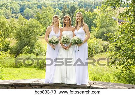 Portrait of women smiling and holding bouquet of flowers, East Meredith, New York State, USA View Large Photo Image Stock Image - Portrait of women smiling and holding bouquet of flowers, East Meredith, New York State, USA. Fotosearch