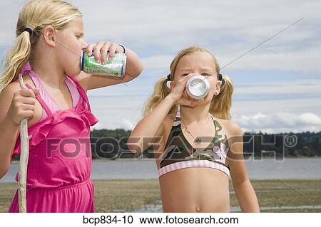 Two girls drinking soda View Large Photo Image Stock Image - Two girls drinking soda. Fotosearch