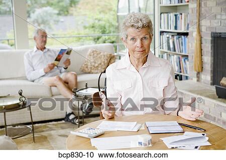 Woman preparing home finance budget View Large Photo Image Stock Image - Woman preparing home finance budget. Fotosearch