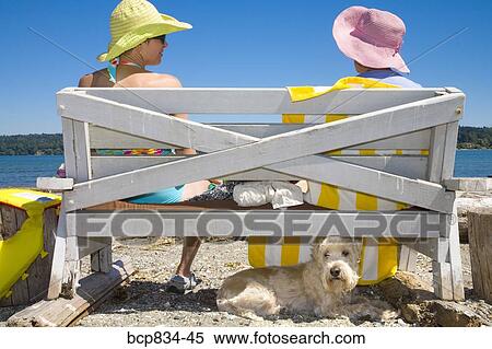 Woman sitting with her mother on a bench View Large Photo Image Stock Photography - Woman sitting with her mother on a bench. Fotosearch