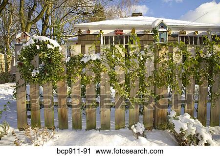 Christmas wreath on an outdoor fence View Large Photo Image Stock Image - Christmas wreath on an outdoor fence. Fotosearch