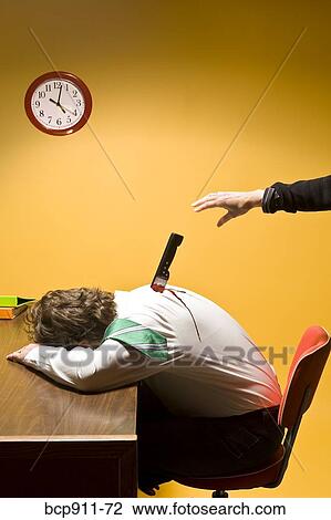 Stock Image - Deceased man in office stabbed in the back. Fotosearch
