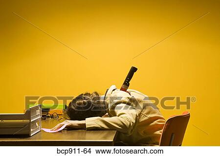 Picture - Deceased woman in office stabbed in the back. Fotosearch