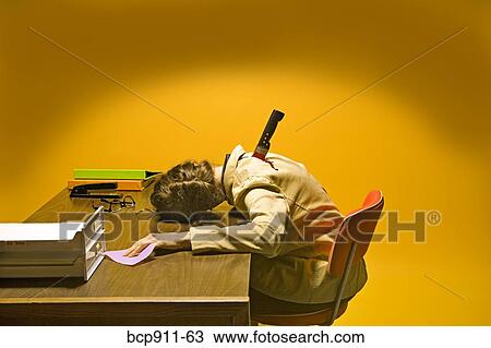 Stock Image - Deceased woman in office stabbed in the back. Fotosearch