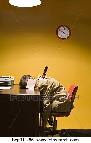 Stock Photograph - Deceased woman in office stabbed in the back. Fotosearch