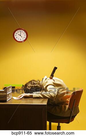 Stock Photography - Deceased woman in office stabbed in the back. Fotosearch