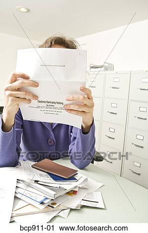 Distraught woman with bankruptcy notice View Large Photo Image Stock Image - Distraught woman with bankruptcy notice. Fotosearch