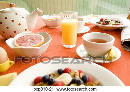 Healthy breakfast of dry cereal and fruit with egg and juice View Large Photo Image Stock Image - Healthy breakfast of dry cereal and fruit with egg and juice. Fotosearch