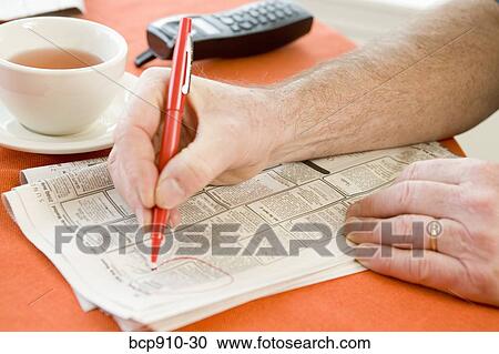 Man researching classifieds View Large Photo Image Stock Image - Man researching classifieds. Fotosearch