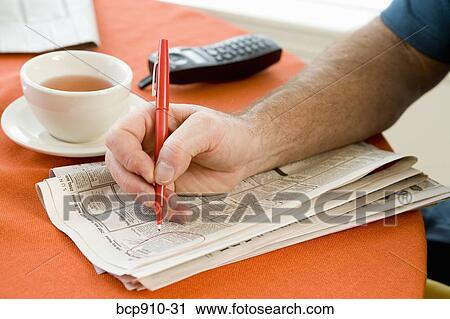 Man researching classifieds View Large Photo Image Stock Image - Man researching classifieds. Fotosearch