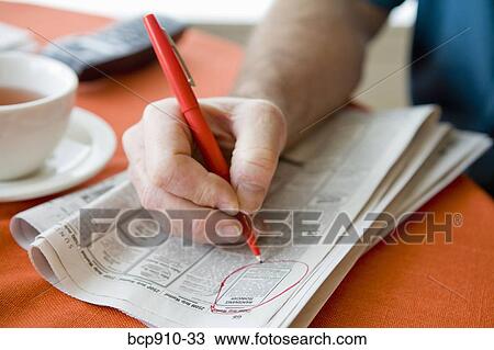 Man researching classifieds View Large Photo Image Stock Image - Man researching classifieds. Fotosearch