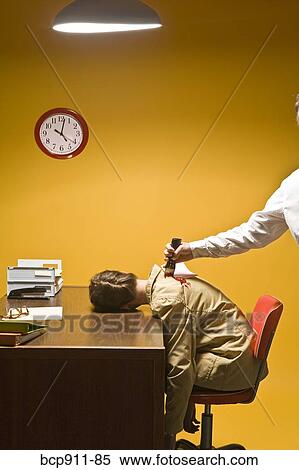 Stock Photography - Woman in office being stabbed in the back. Fotosearch