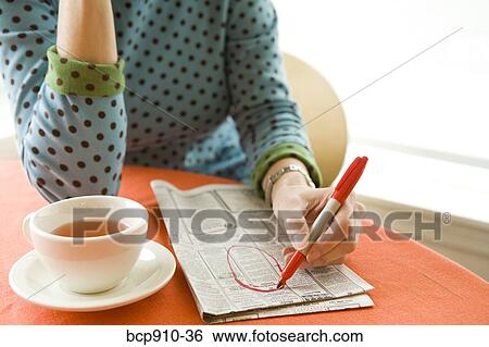 Woman researching classifieds View Large Photo Image Stock Photograph - Woman researching classifieds. Fotosearch