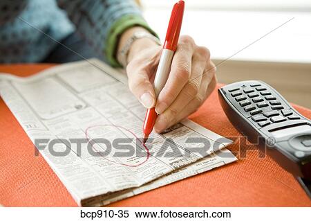 Woman researching classifieds View Large Photo Image Stock Photography - Woman researching classifieds. Fotosearch