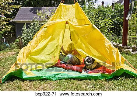 Boy with dogs in backyard tent View Large Photo Image Stock Image - Boy with dogs in backyard tent. Fotosearch