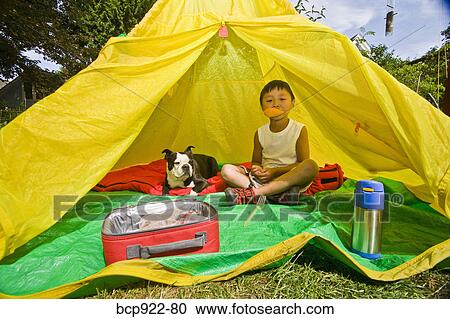 Boy with dogs in backyard tent View Large Photo Image Stock Image - Boy with dogs in backyard tent. Fotosearch