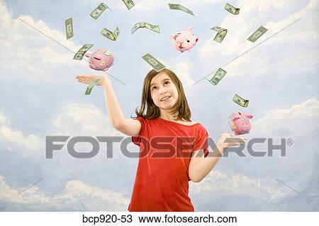 Child juggling money View Large Photo Image Stock Image - Child juggling money. Fotosearch