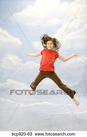 Child jumping in air View Large Photo Image Stock Image - Child jumping in air. Fotosearch