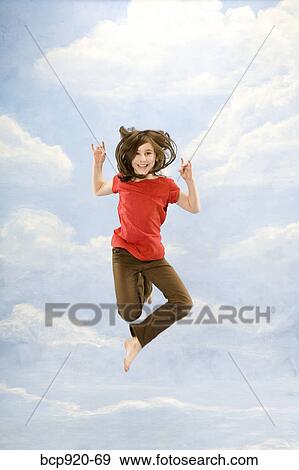 Stock Photo - Child jumping in air. Fotosearch