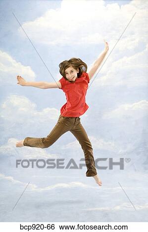 Child jumping in air View Large Photo Image Stock Photograph - Child jumping in air. Fotosearch