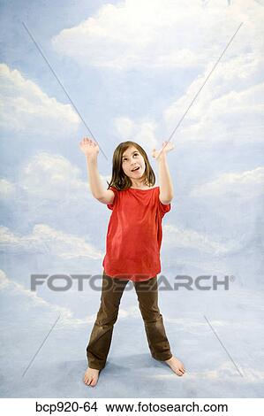 Picture - Child with hands in air. Fotosearch