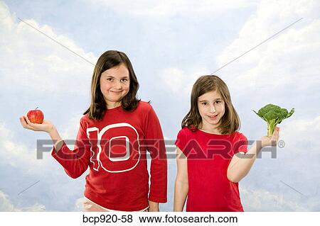 Stock Photo - Children holding different foods. Fotosearch