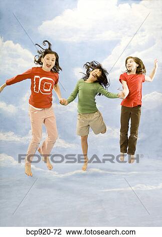 Children jumping in air View Large Photo Image Stock Image - Children jumping in air. Fotosearch