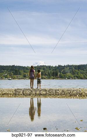 Children jumping on beach View Large Photo Image Stock Photo - Children jumping on beach. Fotosearch