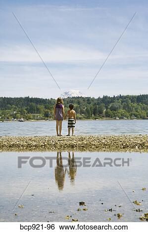 Children jumping on beach View Large Photo Image Stock Photograph - Children jumping on beach. Fotosearch