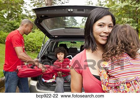 Family getting picnic items out of car View Large Photo Image Stock Image - Family getting picnic items out of car. Fotosearch