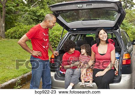 Family getting picnic items out of car View Large Photo Image Stock Image - Family getting picnic items out of car. Fotosearch